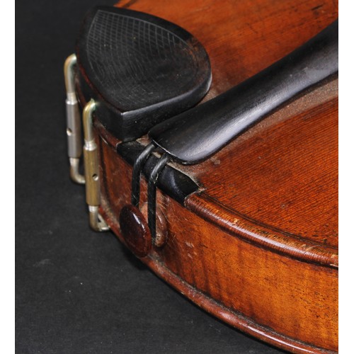 2558 - A violin, the one piece back 35.5cm long excluding button, ebonised tuning pegs, outlined throughout... 