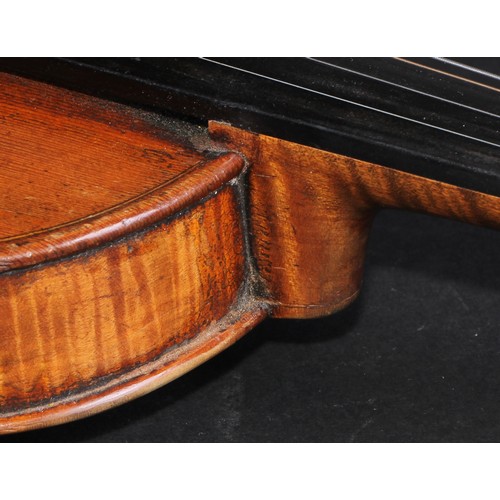 2558 - A violin, the one piece back 35.5cm long excluding button, ebonised tuning pegs, outlined throughout... 