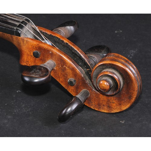 2558 - A violin, the one piece back 35.5cm long excluding button, ebonised tuning pegs, outlined throughout... 