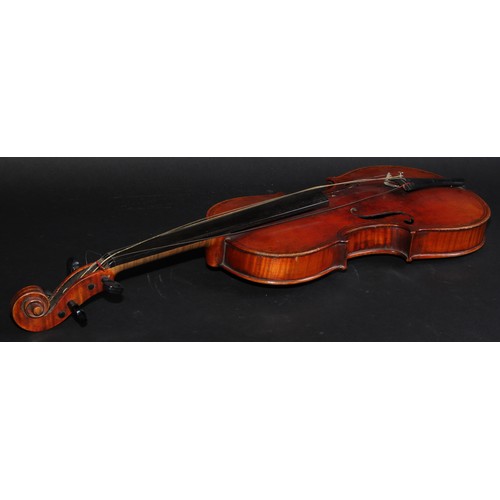 2565 - A violin, the two-piece back 36.5cm long excluding button, paper label printed Giovanni Paolo Maggin... 