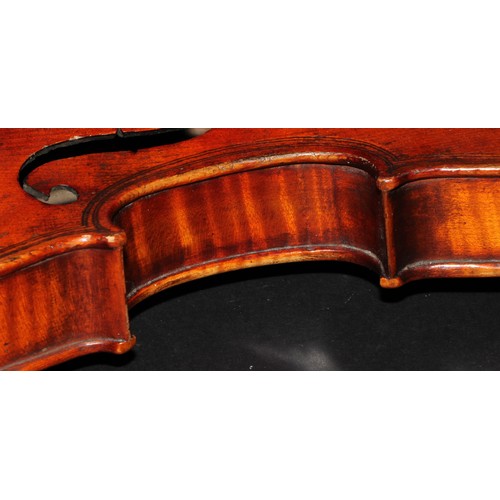 2565 - A violin, the two-piece back 36.5cm long excluding button, paper label printed Giovanni Paolo Maggin... 