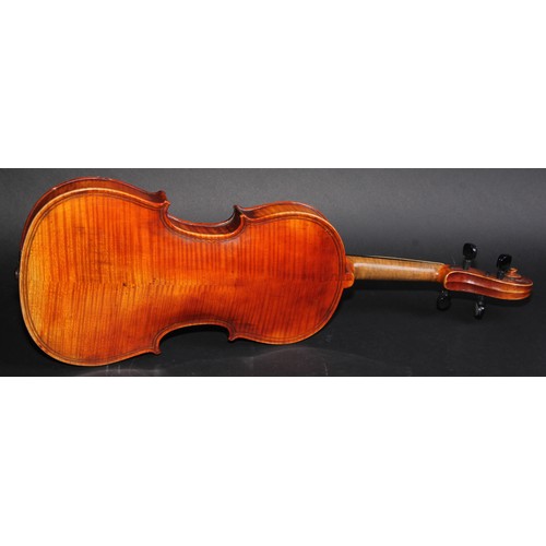 2565 - A violin, the two-piece back 36.5cm long excluding button, paper label printed Giovanni Paolo Maggin... 