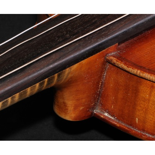 2568 - A violin, the two-piece back 36cm long excluding button, paper Stradivarius label, ebonised tuning p... 