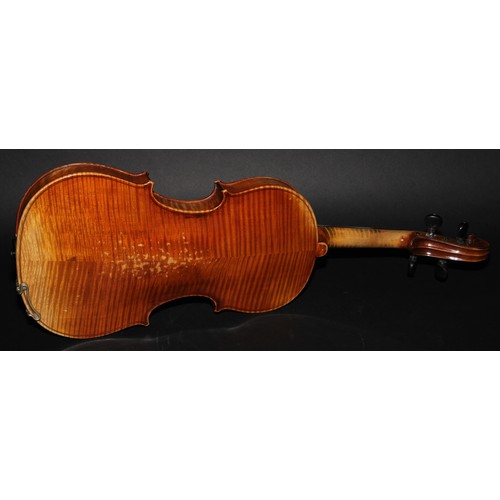 2568 - A violin, the two-piece back 36cm long excluding button, paper Stradivarius label, ebonised tuning p... 