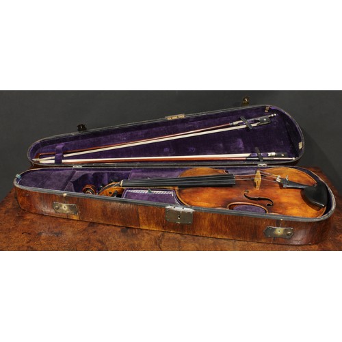 2559 - A violin, the one-piece back 35.5cm long excluding button, ebony tuning pegs, 60cm long overall, the... 