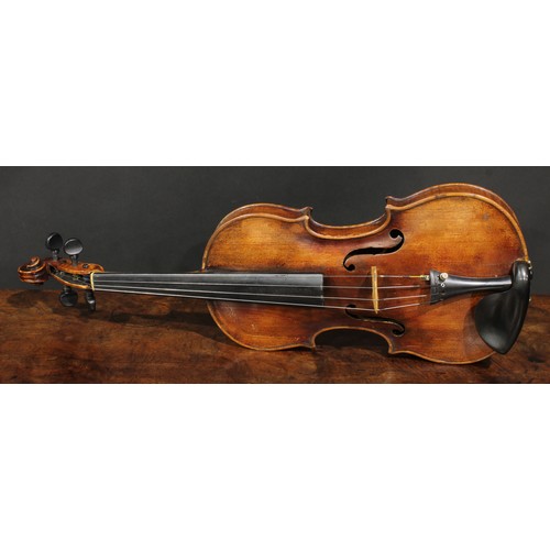 2559 - A violin, the one-piece back 35.5cm long excluding button, ebony tuning pegs, 60cm long overall, the... 