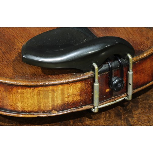 2559 - A violin, the one-piece back 35.5cm long excluding button, ebony tuning pegs, 60cm long overall, the... 