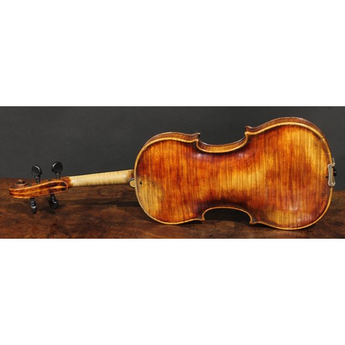 2559 - A violin, the one-piece back 35.5cm long excluding button, ebony tuning pegs, 60cm long overall, the... 