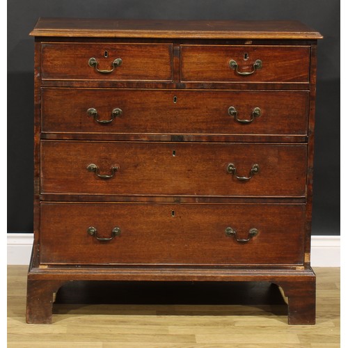 1304 - A George III mahogany chest, of two short and three long graduated drawers, brass swan neck handles,... 