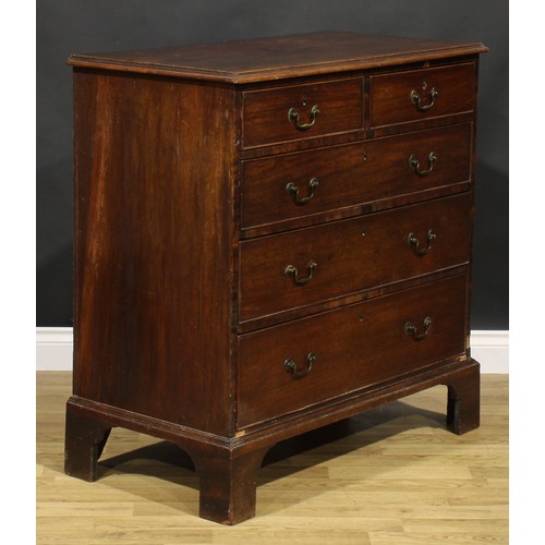 1304 - A George III mahogany chest, of two short and three long graduated drawers, brass swan neck handles,... 