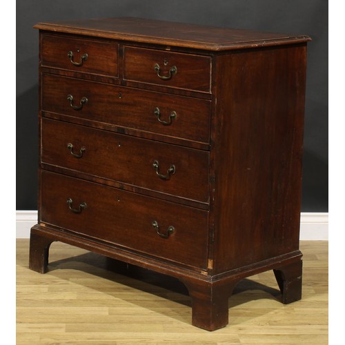 1304 - A George III mahogany chest, of two short and three long graduated drawers, brass swan neck handles,... 