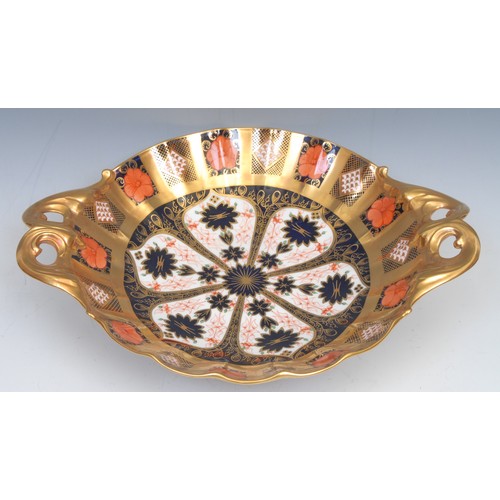 230 - A Royal Crown Derby Imari palette 1128 pattern two handled shaped circular comport, solid gold band,... 