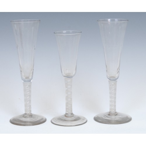 319 - A pair of George III opaque twist ale glasses, each with fluted conical bowl, double-helix stem, and... 