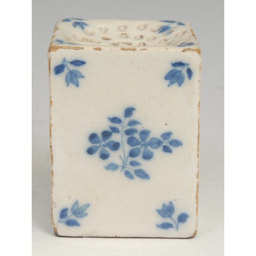 112 - An 18th century Delft square pounce pot, painted in tones of blue with scattered floral sprigs, 6cm ... 