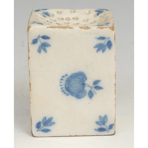 112 - An 18th century Delft square pounce pot, painted in tones of blue with scattered floral sprigs, 6cm ... 