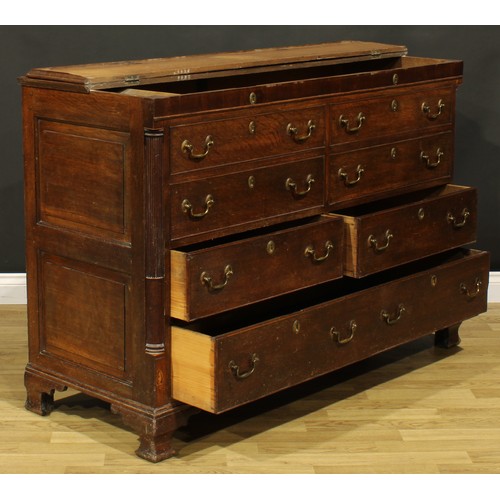 1664 - A George III mahogany banded oak Lancashire chest, hinged top above four blind, two short and one lo... 