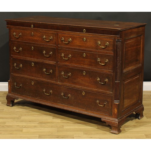 1664 - A George III mahogany banded oak Lancashire chest, hinged top above four blind, two short and one lo... 