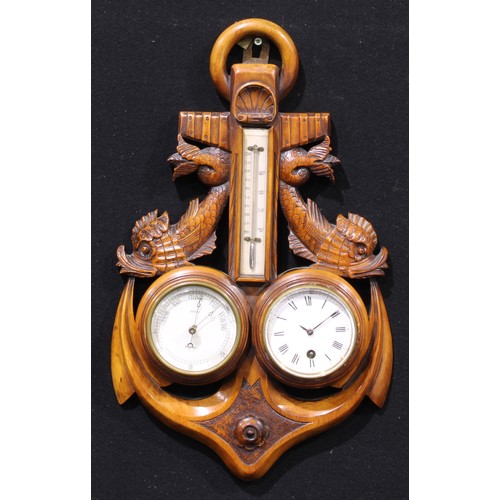 1318 - An early 20th century wall hanging combination aneroid barometer, thermometer and timepiece, of mari... 