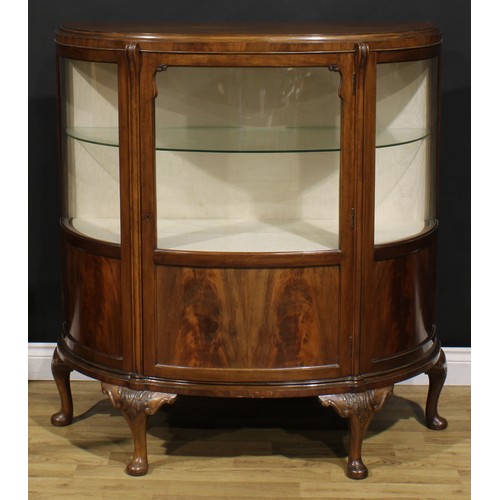 2068 - A George II Revival walnut demi-lune side cabinet, moulded top above a glazed door and rectangular p... 