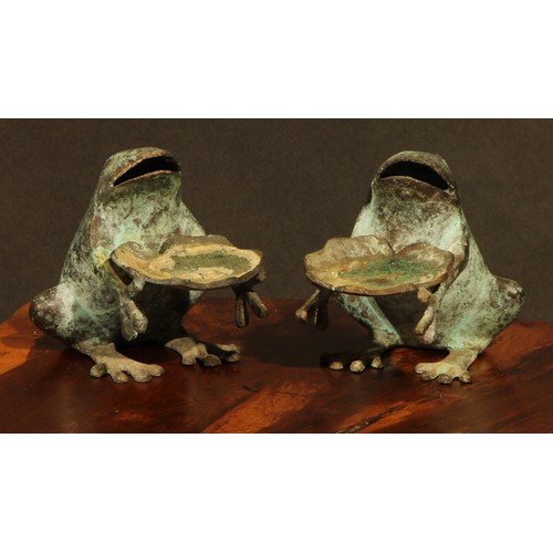 2179 - A pair of verdigris patinated novelty candle waiters, each cast as a frog, 10cm high