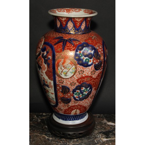 456 - A Japanese ovoid vase, decorated in the Imari palette with birds, landscapes and floral motifs, pick... 