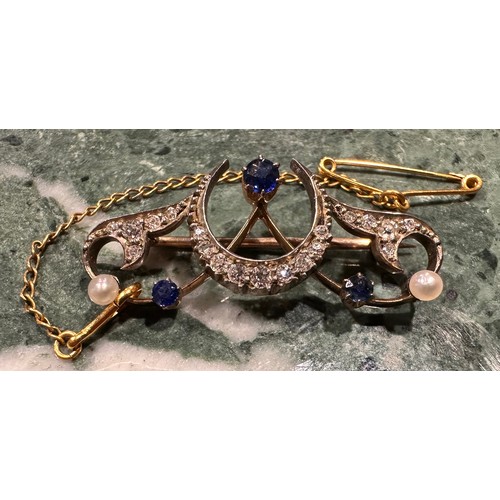 890 - A diamond, sapphire and seed pearl Art Deco Crescent brooch, set with three blue round cut sapphires... 