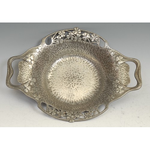84 - Liberty - a Tudric pewter Art Nouveau dish, design no.0287, embossed with clover on a planished grou... 