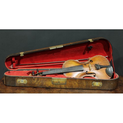 2564 - A violin, the two-piece back 35.75cm long excluding button, rosewood tuning pegs, outlined throughou... 