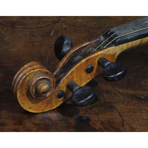 2564 - A violin, the two-piece back 35.75cm long excluding button, rosewood tuning pegs, outlined throughou... 