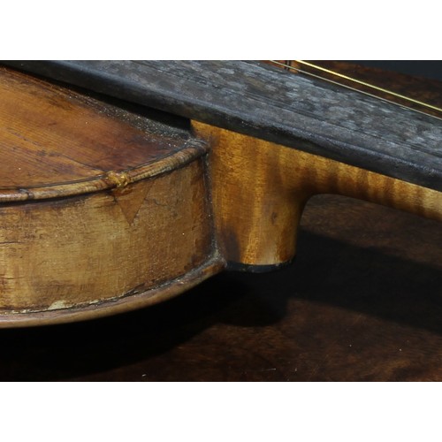 2564 - A violin, the two-piece back 35.75cm long excluding button, rosewood tuning pegs, outlined throughou... 