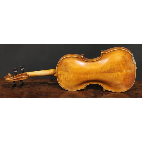 2564 - A violin, the two-piece back 35.75cm long excluding button, rosewood tuning pegs, outlined throughou... 