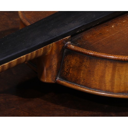 2563 - A violin, the two-piece back 35.75cm long excluding button, outlined throughout with purfling, 60cm ... 