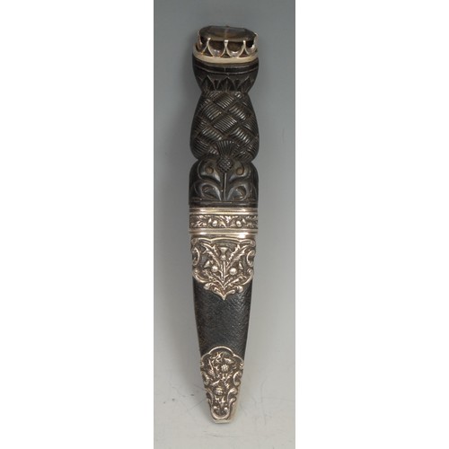 2527 - A Scottish silver mounted sgian dubh dagger, 8cm blade, the hilt and scabbard fittings carved and ch... 