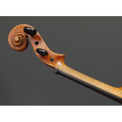 2552 - A violin, the two-piece back 36cm long excluding button, ebony tuning pegs, outlined throughout with... 