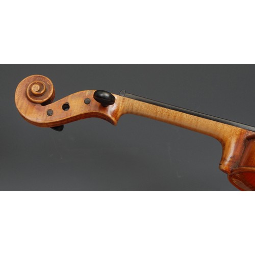 2552 - A violin, the two-piece back 36cm long excluding button, ebony tuning pegs, outlined throughout with... 