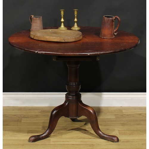 1534 - A George III mahogany tripod supper table, circular top, turned baluster pillar, cabriole legs, pad ... 