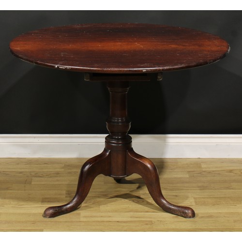 1534 - A George III mahogany tripod supper table, circular top, turned baluster pillar, cabriole legs, pad ... 