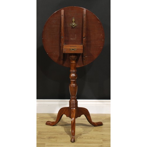 1524 - A 19th century mahogany tripod wine table, dished circular tilting top, turned column, cabriole legs... 