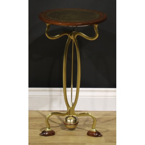 1550 - An Art Nouveau brass and hardwood wine or lamp table, circular top inlaid with a reserve chased with... 