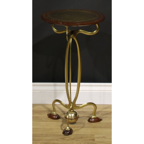 1550 - An Art Nouveau brass and hardwood wine or lamp table, circular top inlaid with a reserve chased with... 