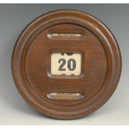 1499 - An early 20th century oak circular wall mounted perpetual calendar, glazed apertures for day, date a... 