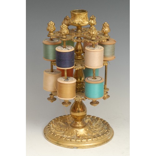 1870 - Sewing - a 19th century brass two-tier cotton reel stand, cast throughout with scrolling acanthus, c... 