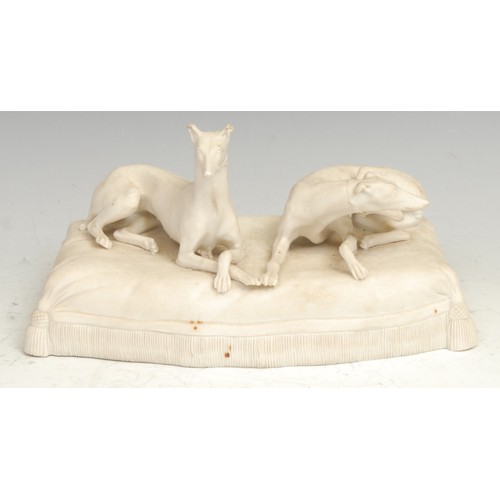 1734 - A 19th century parian ware sculpture, modelled with two greyhounds on a tasselled cushion, 18.56cm w... 