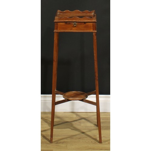 1248 - A 19th century mahogany kettle stand, square top with wavy gallery above a slide, X-stretcher with u... 