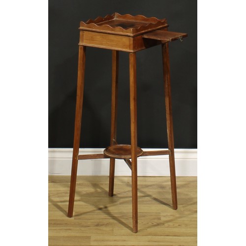 1248 - A 19th century mahogany kettle stand, square top with wavy gallery above a slide, X-stretcher with u... 