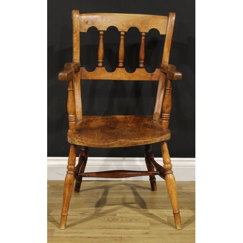 1523 - A 19th century fruitwood, elm and deciduous timber vernacular elbow chair, in the Windsor tradition,... 