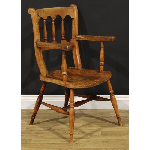 1523 - A 19th century fruitwood, elm and deciduous timber vernacular elbow chair, in the Windsor tradition,... 