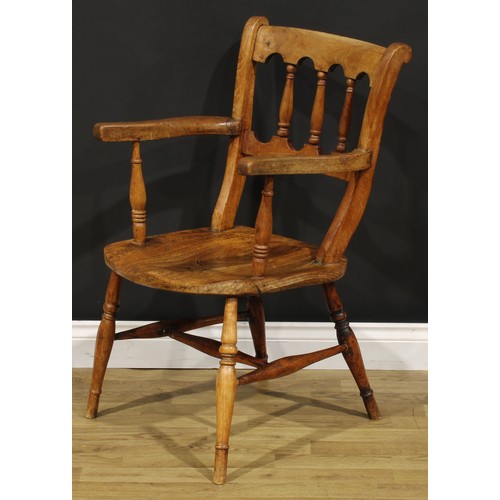 1523 - A 19th century fruitwood, elm and deciduous timber vernacular elbow chair, in the Windsor tradition,... 