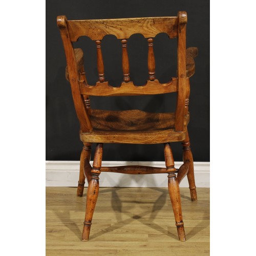 1523 - A 19th century fruitwood, elm and deciduous timber vernacular elbow chair, in the Windsor tradition,... 