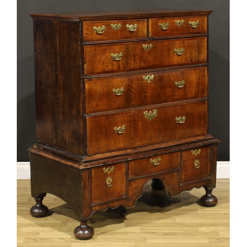 2123 - A Queen Anne/George I walnut chest on stand, moulded top above two short and three long graduated dr... 